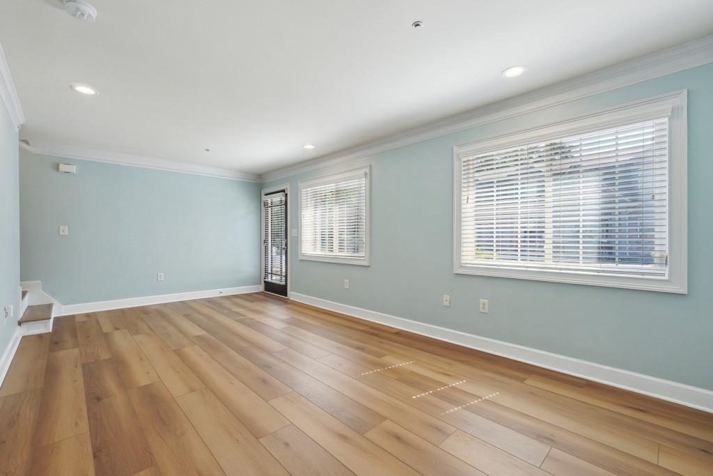 104 Rondak Circle Smyrna, GA 30080 - Photo 9 of 33 a view of an empty room with wooden floor and a window