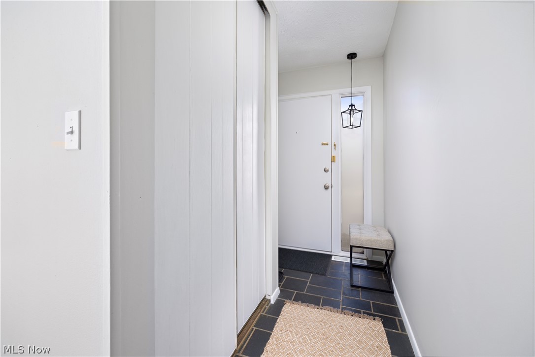 32969 Mills Road North Ridgeville, OH 44039 - Photo 3 of 29 Hallway with dark tile floors