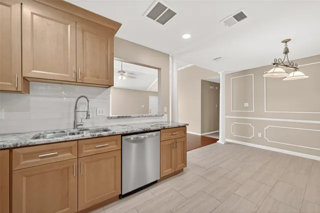 an empty room with a ceiling fan and a fan