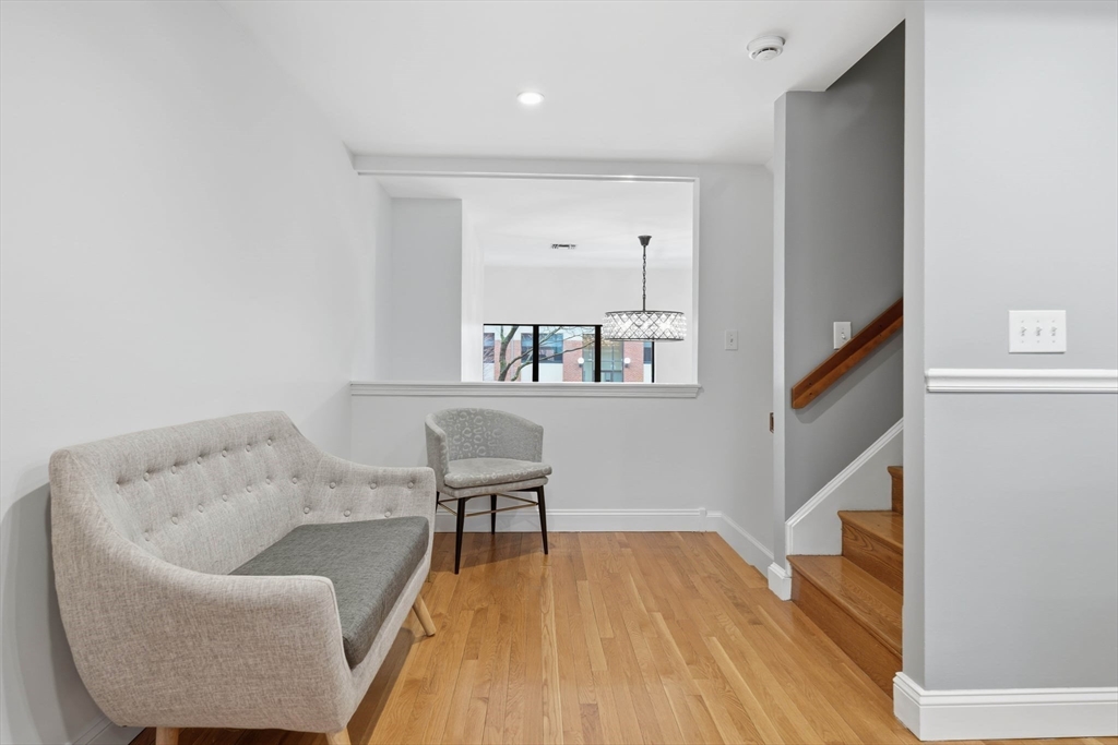 85 Brainerd Road, Unit TH7 Boston, MA 02134 - Photo 13 of 41 a living room with furniture and a wooden floor