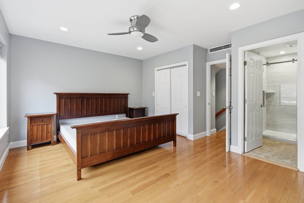 85 Brainerd Road, Unit TH7 Boston, MA 02134 - Photo 15 of 41 a bedroom with furniture and wooden floor