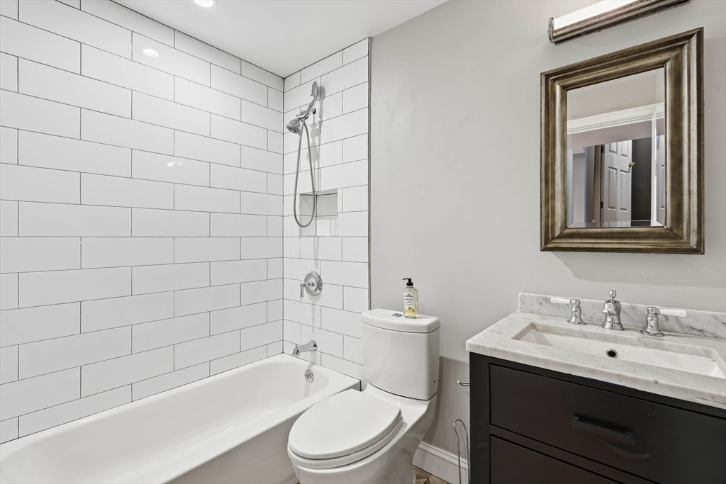 85 Brainerd Road, Unit TH7 Boston, MA 02134 - Photo 22 of 41 a bathroom with a sink a toilet and shower