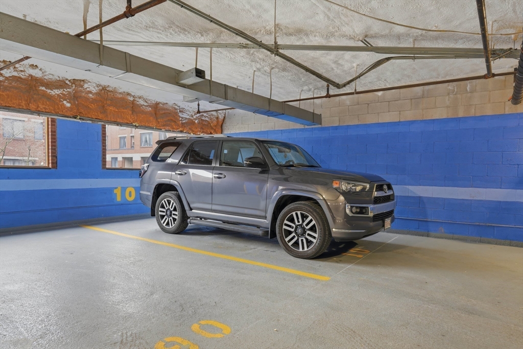 85 Brainerd Road, Unit TH7 Boston, MA 02134 - Photo 31 of 41 a view of a car in garage