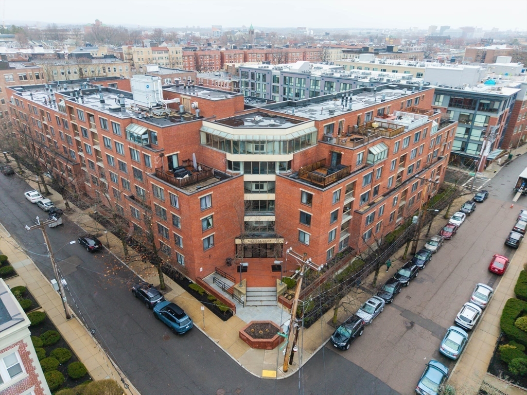 85 Brainerd Road, Unit TH7 Boston, MA 02134 - Photo 35 of 41 a city view with tall buildings