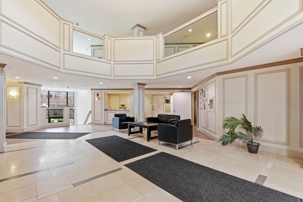 85 Brainerd Road, Unit TH7 Boston, MA 02134 - Photo 40 of 41 a lobby with furniture and potted plants