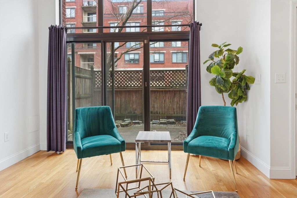 85 Brainerd Road, Unit TH7 Boston, MA 02134 - Photo 6 of 41 a living room with furniture and a potted plant