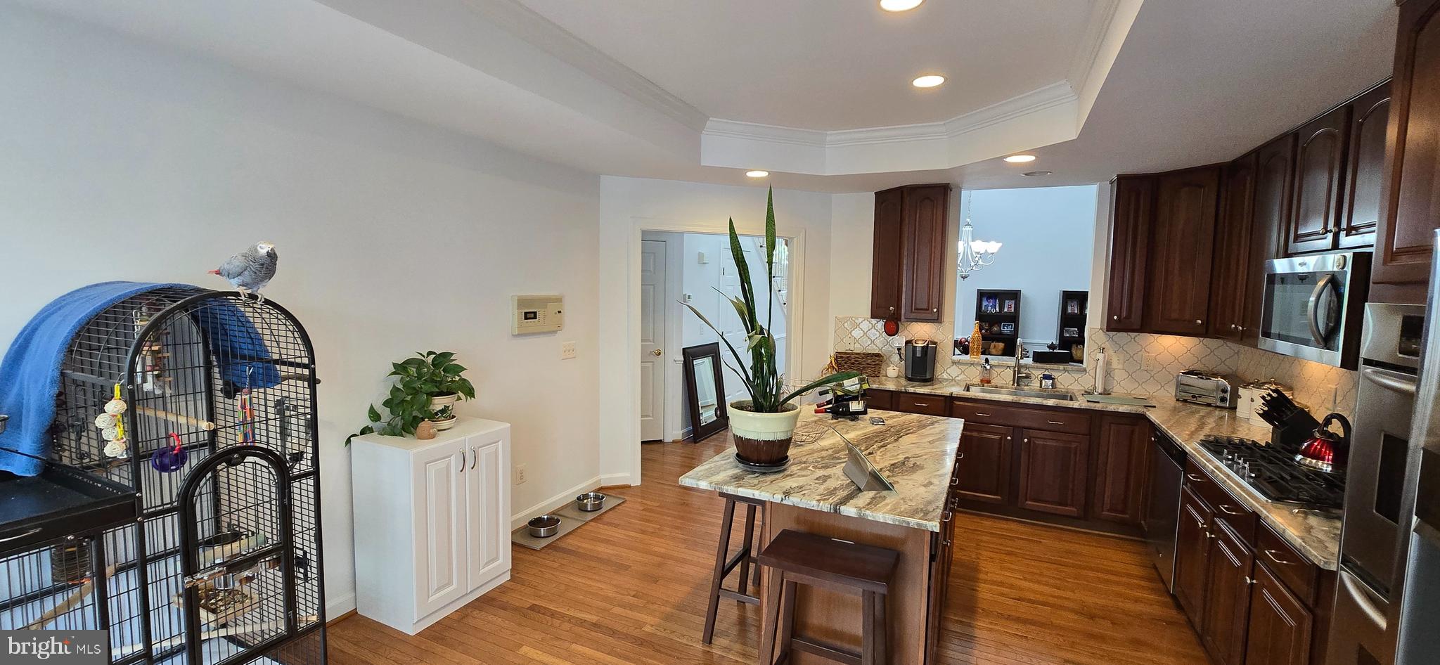 7357 Cluster House Way Gainesville, VA 20155 - Photo 14 of 28 a view of a kitchen and dining room
