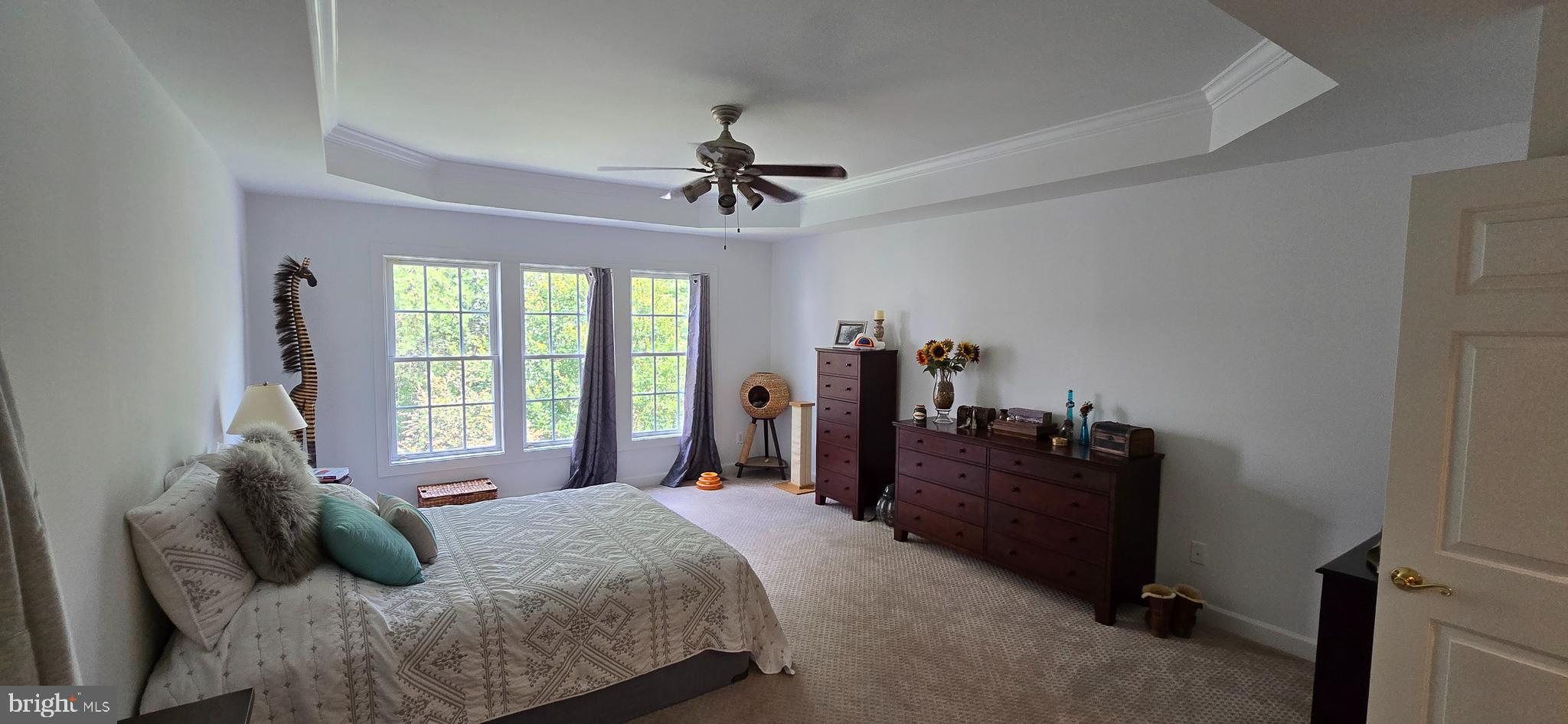 7357 Cluster House Way Gainesville, VA 20155 - Photo 15 of 28 a bedroom with a bed dresser and a window