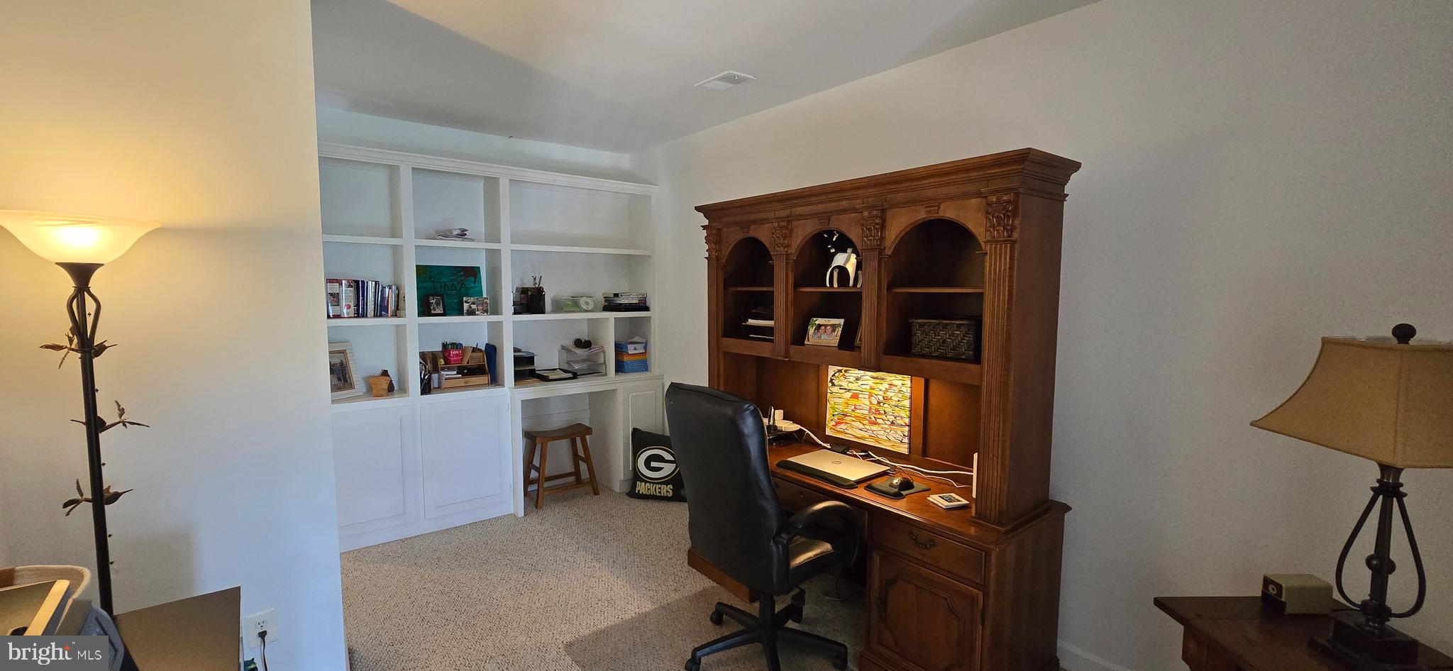 7357 Cluster House Way Gainesville, VA 20155 - Photo 19 of 28 a view of a workspace with furniture and a window
