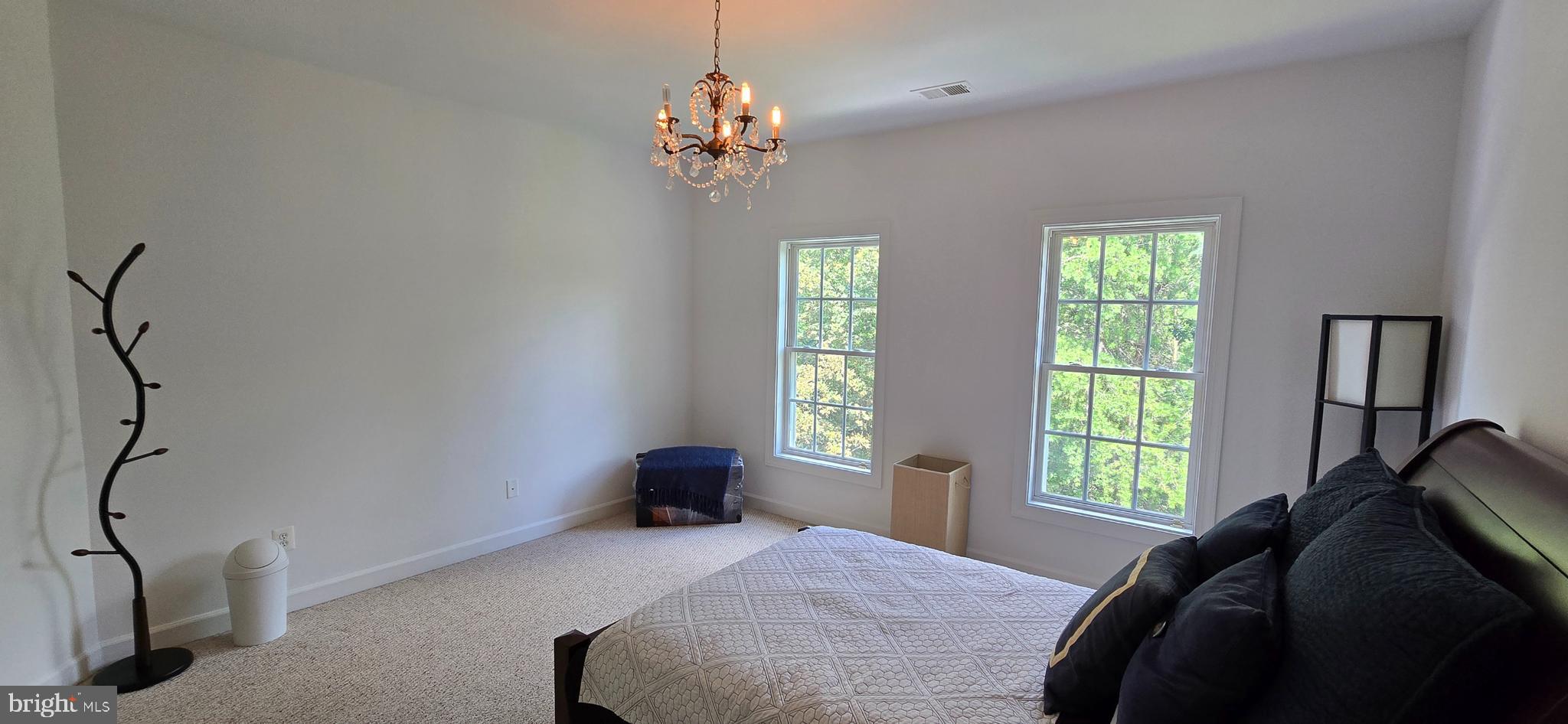 7357 Cluster House Way Gainesville, VA 20155 - Photo 23 of 28 a bedroom with a bed and a window
