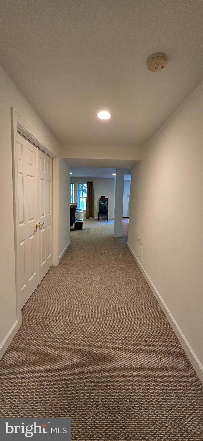 7357 Cluster House Way Gainesville, VA 20155 - Photo 24 of 28 a view of a room with window and fireplace