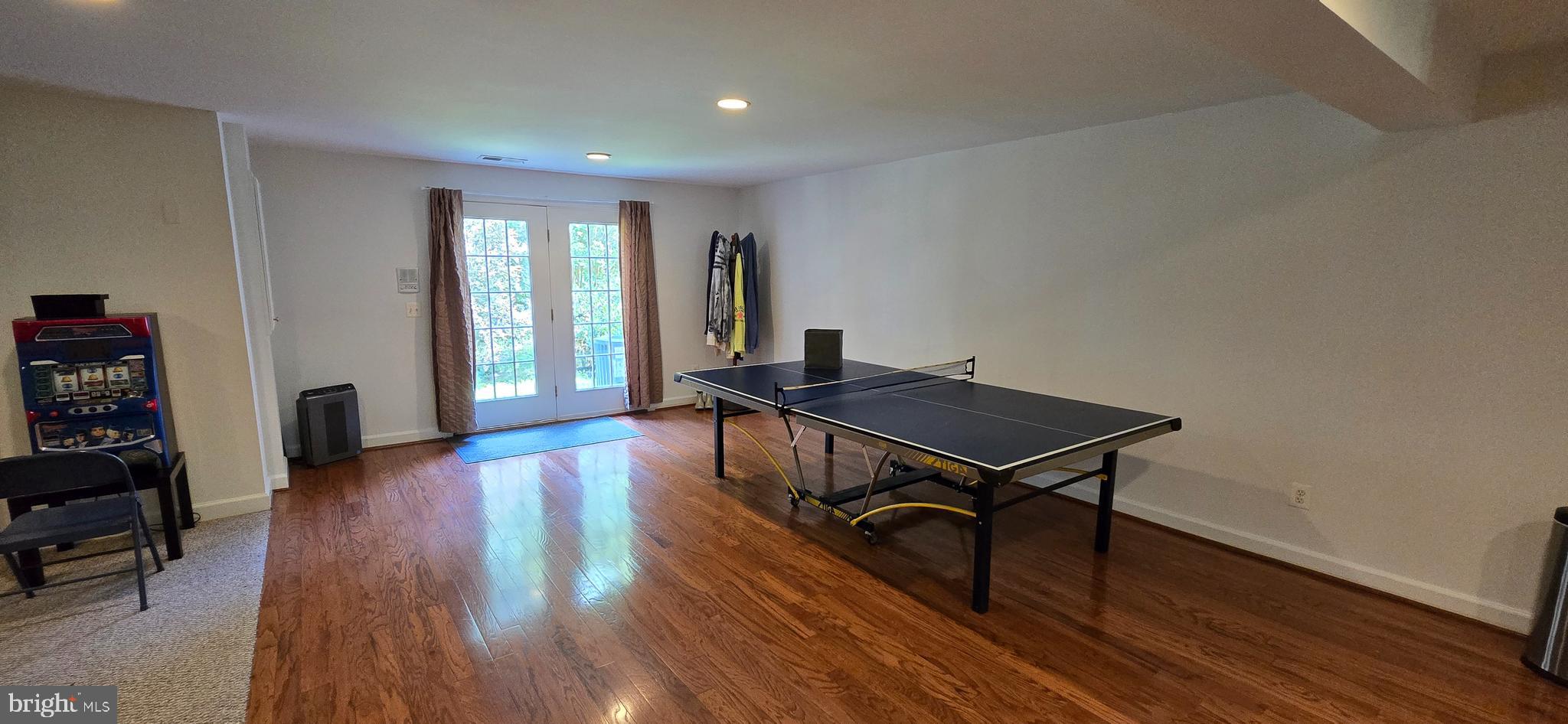 7357 Cluster House Way Gainesville, VA 20155 - Photo 26 of 28 a living room with furniture and a wooden floor