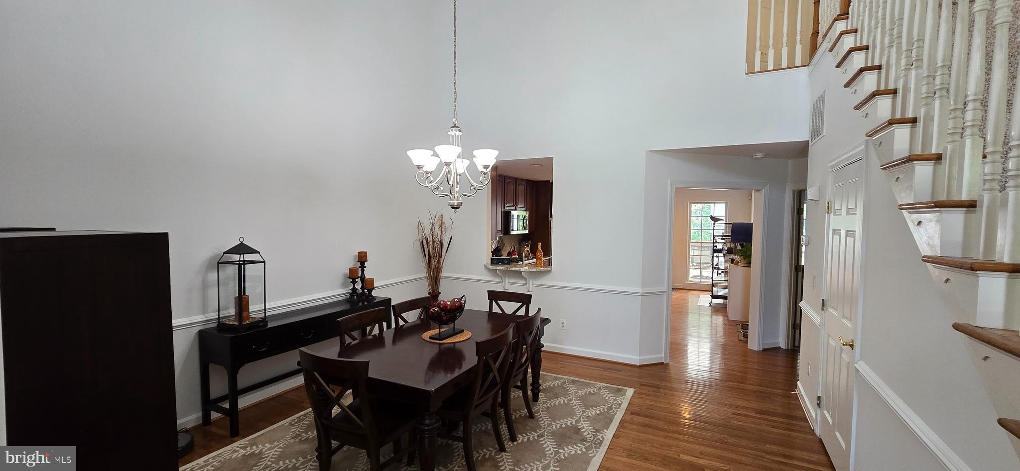 7357 Cluster House Way Gainesville, VA 20155 - Photo 5 of 28 a view of a dining room with furniture
