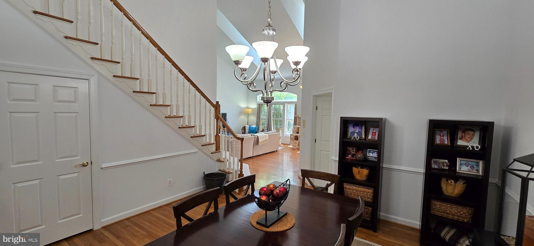 7357 Cluster House Way Gainesville, VA 20155 - Photo 8 of 28 a view of entryway with wooden floor