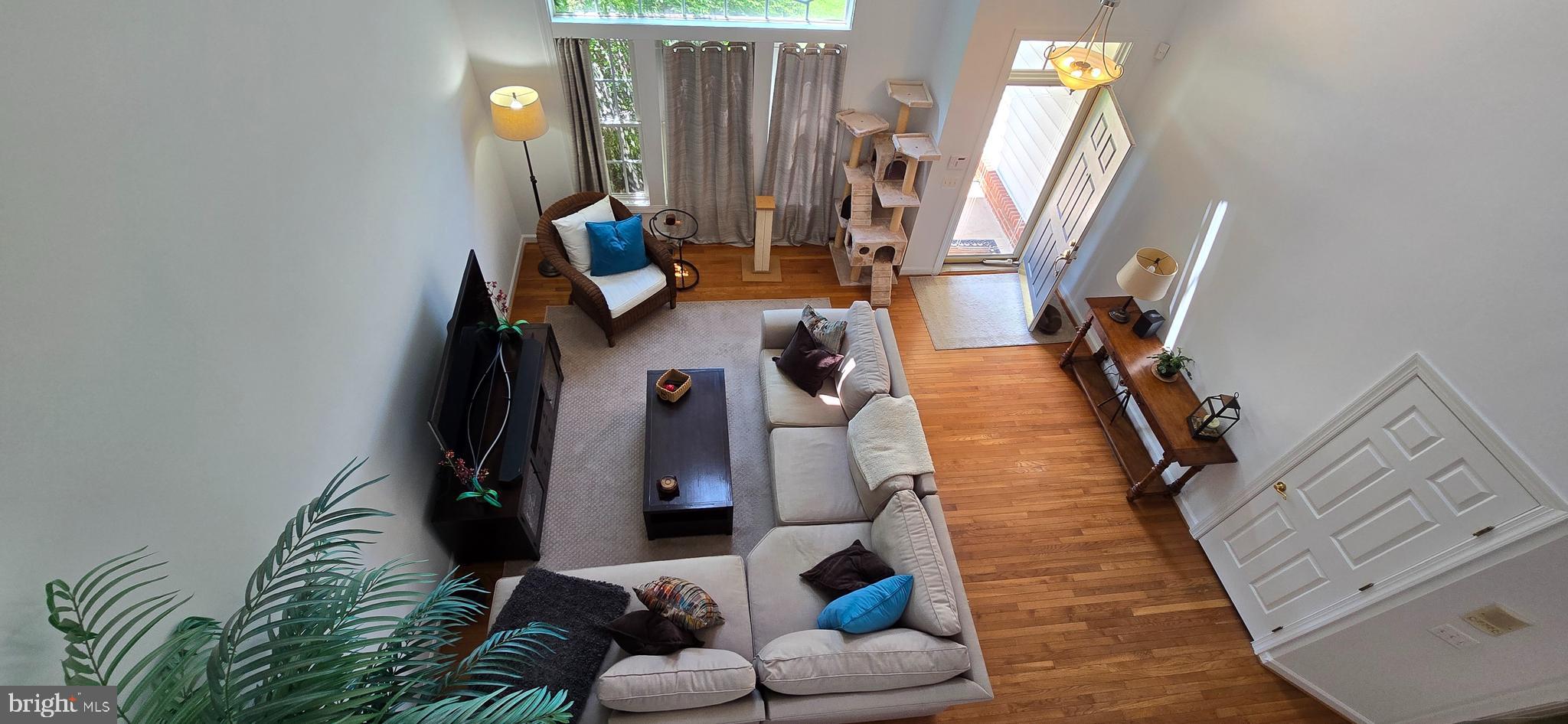 7357 Cluster House Way Gainesville, VA 20155 - Photo 9 of 28 a living room with furniture and wooden floor