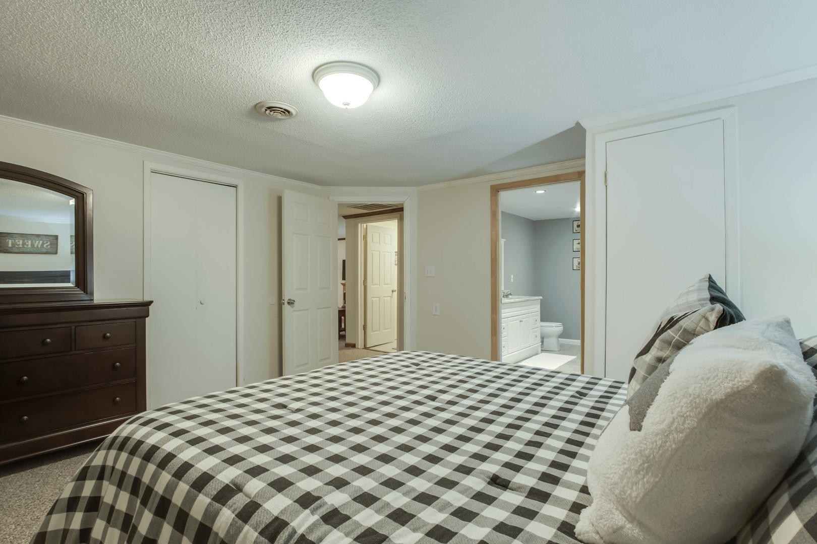 6104 Ricky Allen Road Corryton, TN 37721 - Photo 32 of 36 a bedroom with a bed and a dresser