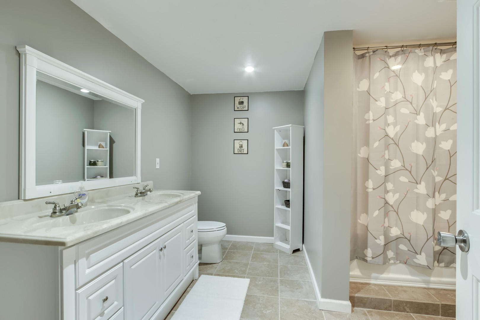 6104 Ricky Allen Road Corryton, TN 37721 - Photo 33 of 36 a bathroom with a granite countertop sink a toilet a shower and a mirror
