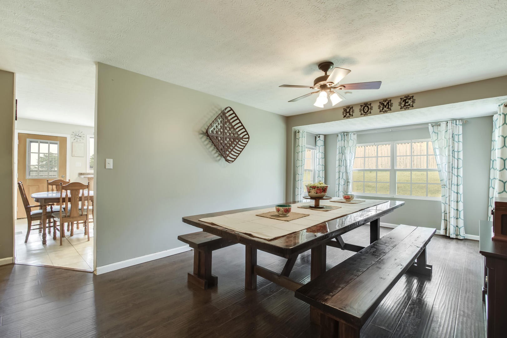 6104 Ricky Allen Road Corryton, TN 37721 - Photo 7 of 36 a view of a dining room with furniture window and wooden floor