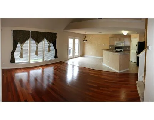 a kitchen with a wooden floor