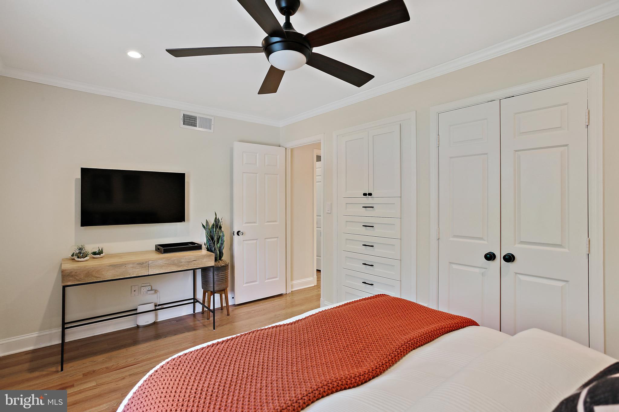 1816 Ruxton Road Baltimore, MD 21204 - Photo 43 of 92 a bedroom with a bed and a flat screen tv