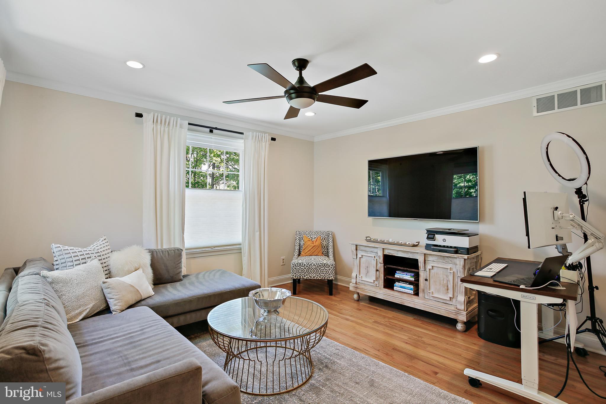1816 Ruxton Road Baltimore, MD 21204 - Photo 48 of 92 a living room with furniture and a flat screen tv