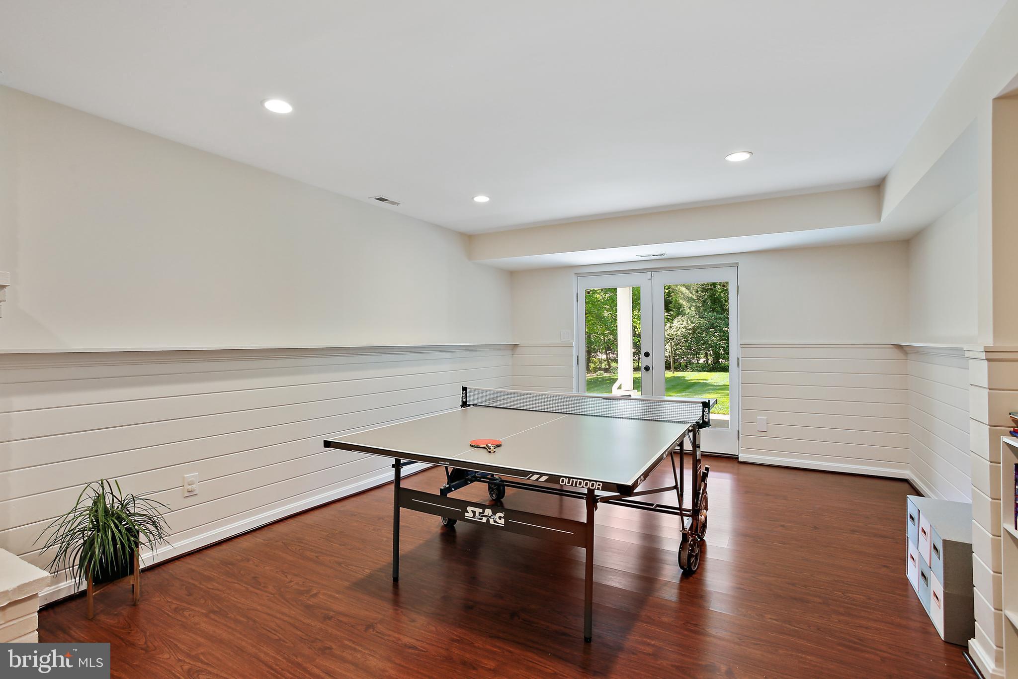 1816 Ruxton Road Baltimore, MD 21204 - Photo 54 of 92 a living room with furniture floor to ceiling window and wooden floor