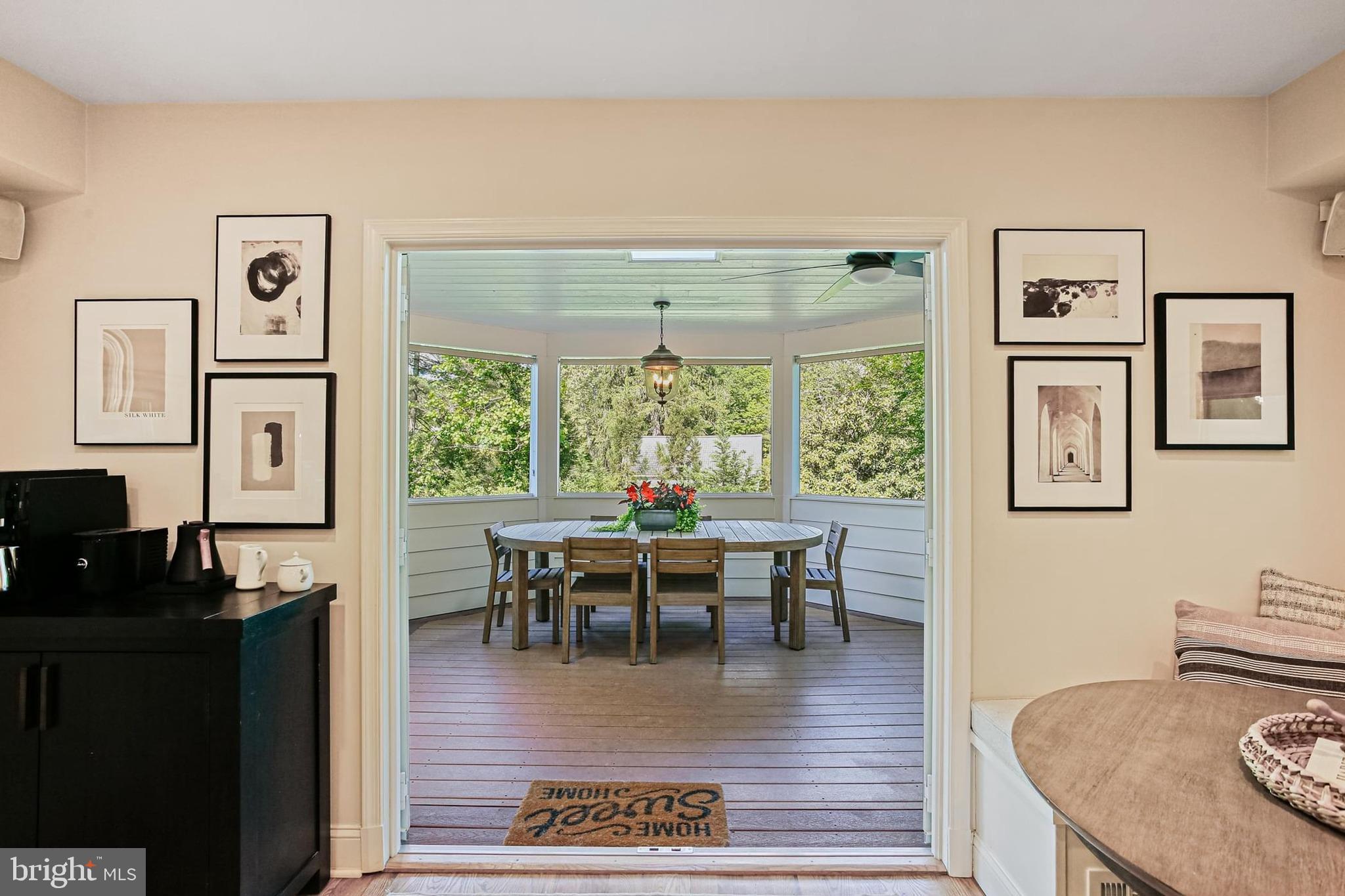 1816 Ruxton Road Baltimore, MD 21204 - Photo 6 of 92 a dining room with wooden floor a glass table and chairs