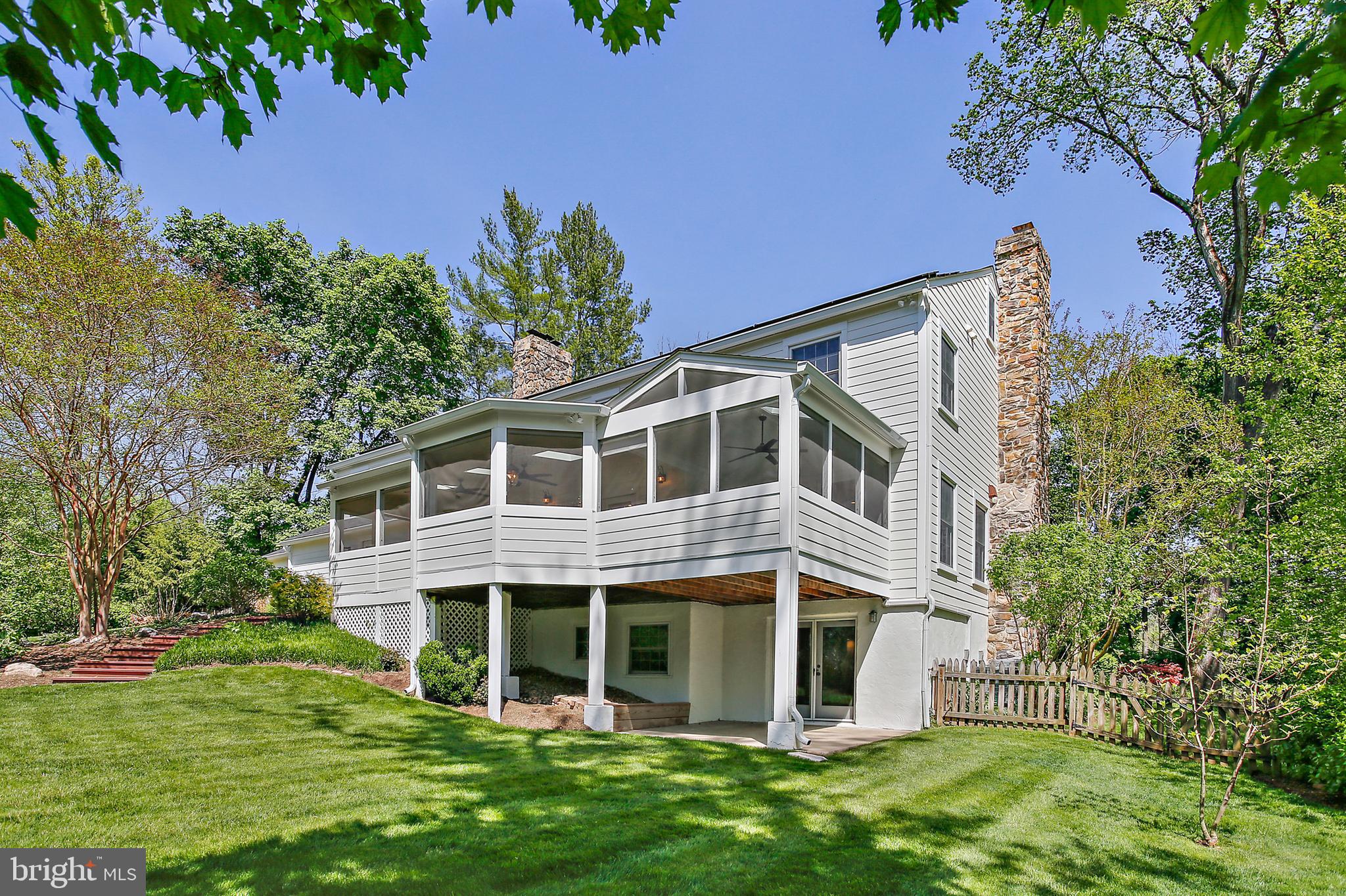 1816 Ruxton Road Baltimore, MD 21204 - Photo 72 of 92 a front view of a house with a garden