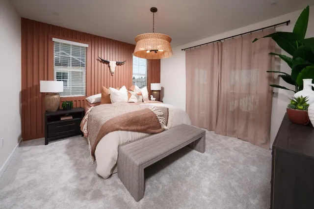 a bedroom with bed and window