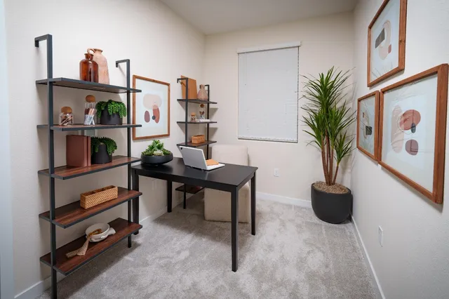 a view of a workspace with furniture