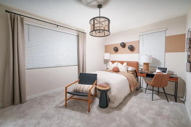 a bedroom with bed and a window