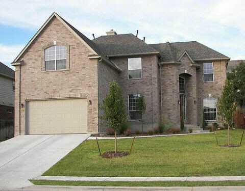 10241 Chestnut Ridge Road Austin, TX 78726 - Photo 1 of 1 a front view of a house with a yard