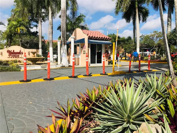 a view of a swimming pool with an outdoor seating
