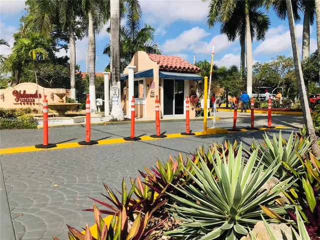 a view of a swimming pool with an outdoor seating
