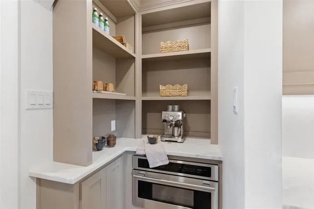 a kitchen with a stove and a microwave