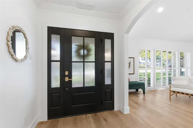 a bedroom with furniture and a window