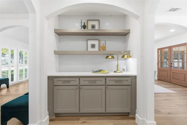 a kitchen with cabinets and window