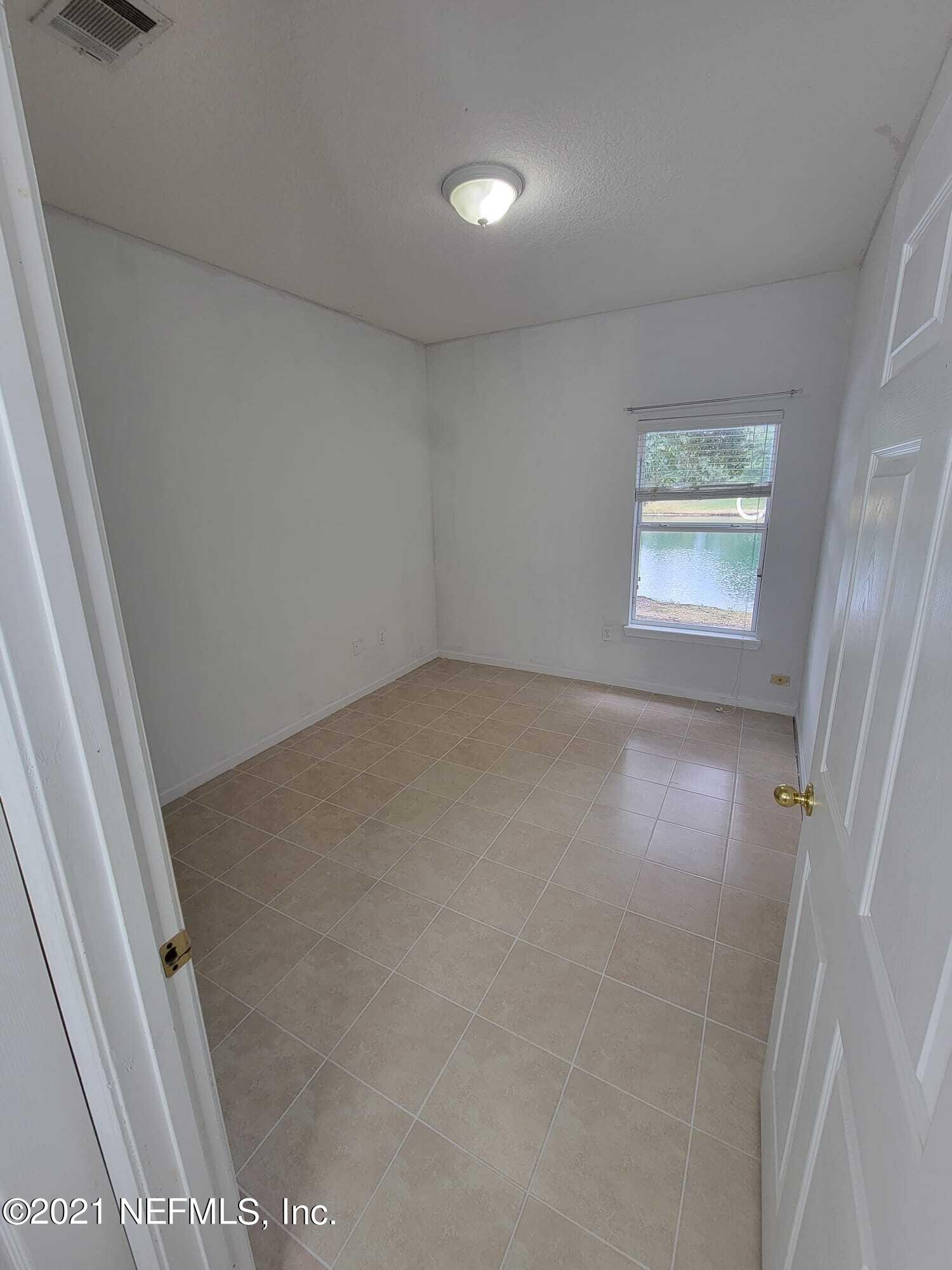 3641 Kirkpatrick Circle, Unit 4 Jacksonville, FL 32210 - Photo 13 of 17 an empty room with windows