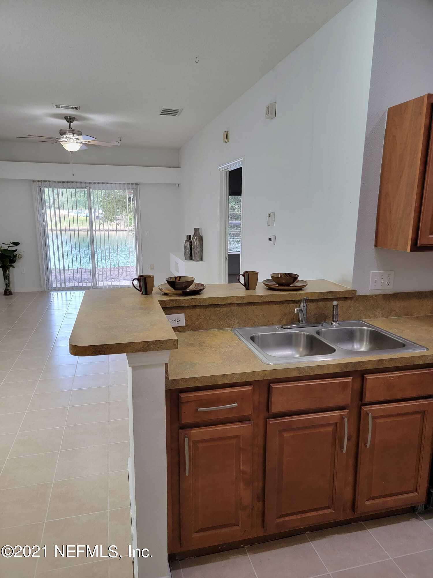3641 Kirkpatrick Circle, Unit 4 Jacksonville, FL 32210 - Photo 8 of 17 a kitchen with a sink and cabinets