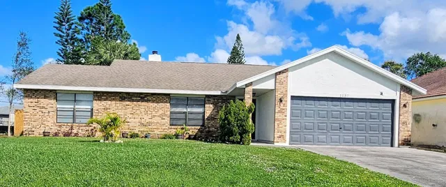 front view of a house with a yard