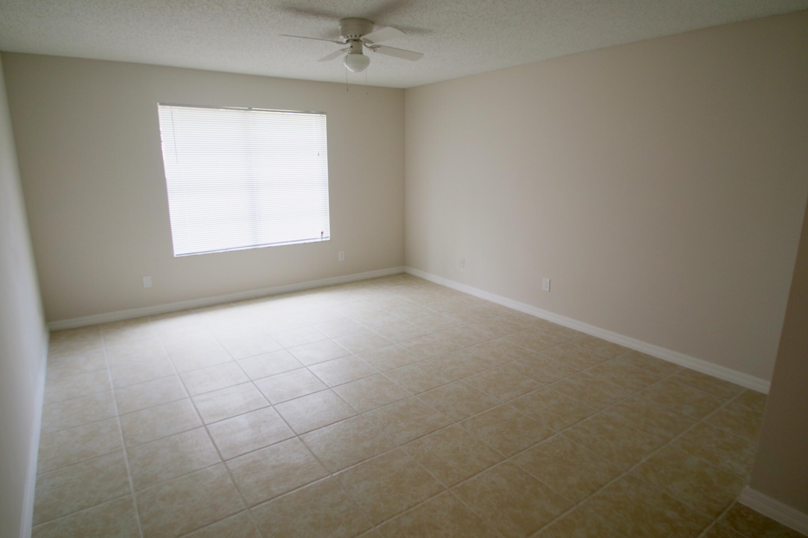 1137 Southwest Estaugh Avenue Port St. Lucie, FL 34953 - Photo 6 of 11 an empty room with a window