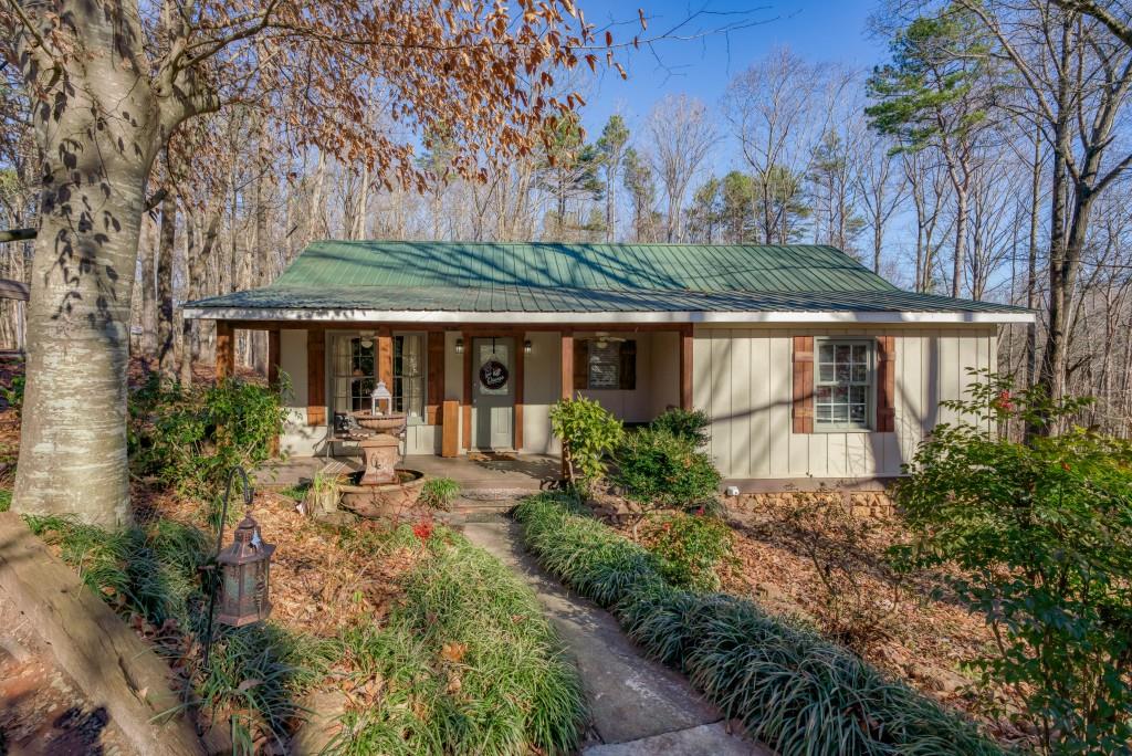 590 Nichols Road Pendergrass, GA 30567 - Photo 1 of 1 a view of a house with sitting area and garden