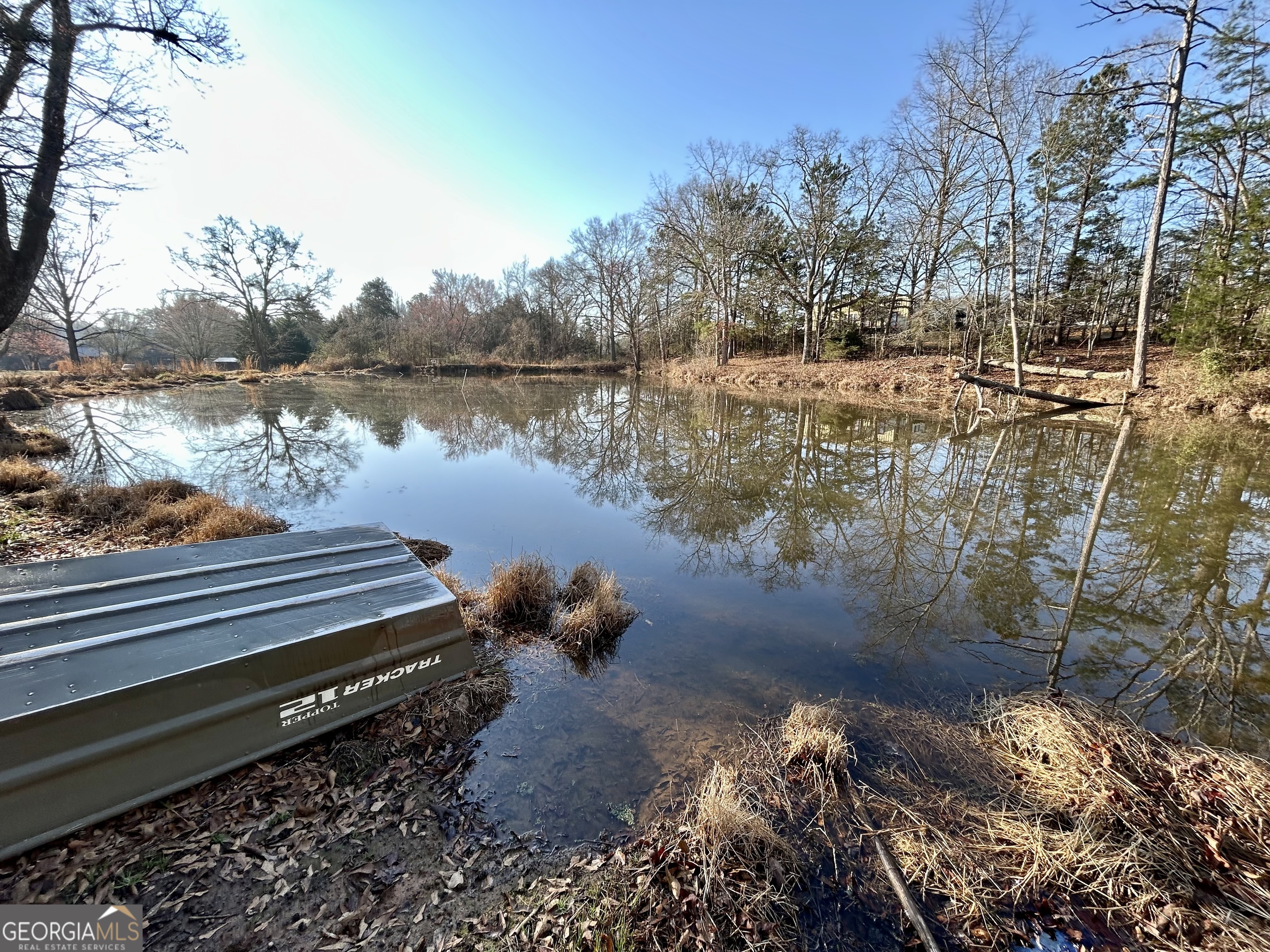 190 Cedar Pond Road Hartwell, GA 30643 - Photo 16 of 22 a lake view with boat and trees in the background