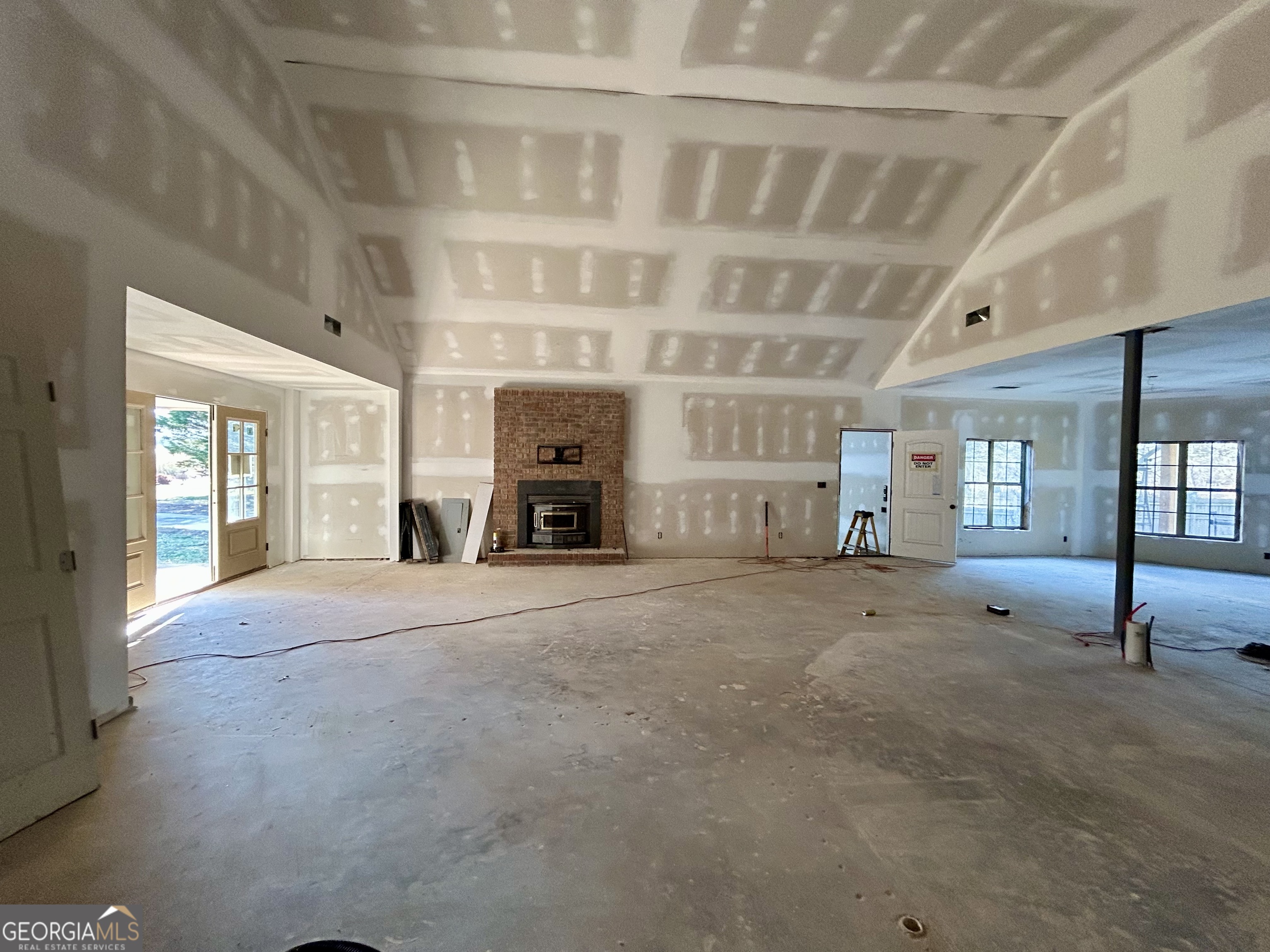 190 Cedar Pond Road Hartwell, GA 30643 - Photo 5 of 22 a view of empty room with fireplace and windows