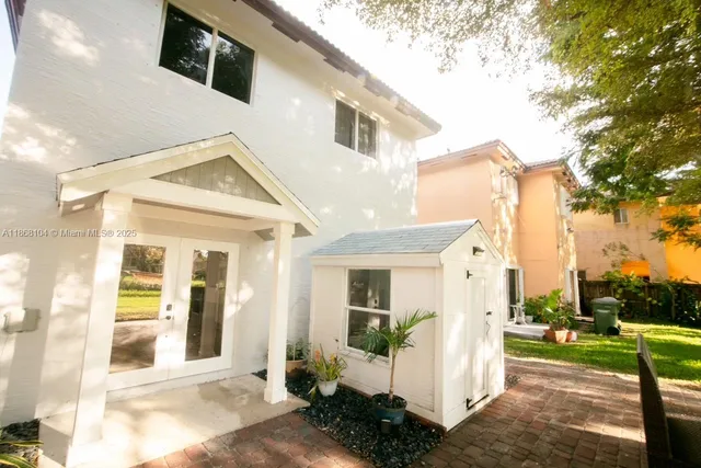 a view of yard with swimming pool and green space