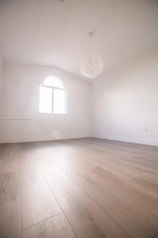 an empty room with a empty space and window