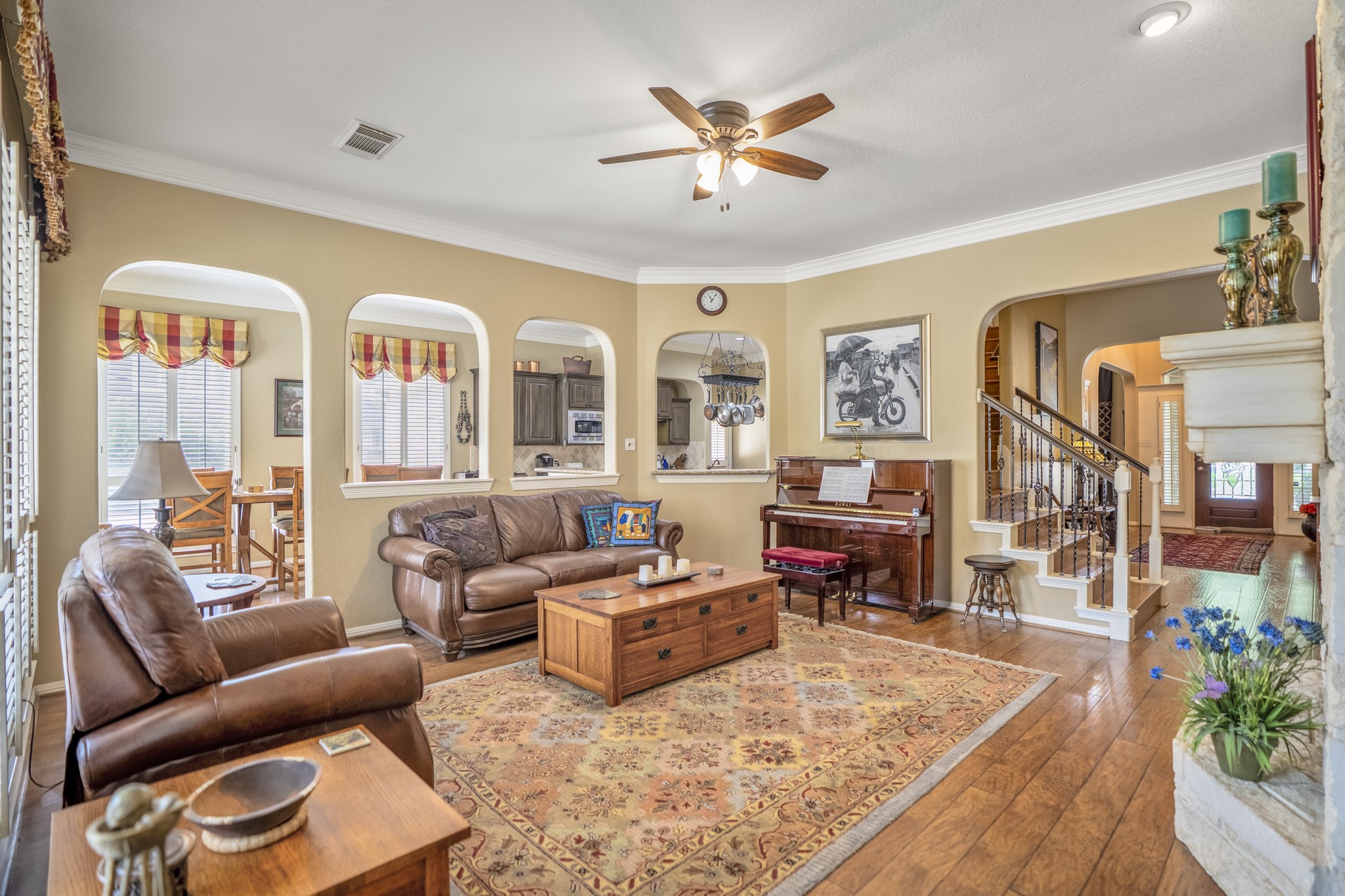 1438 Hatchmere Place Spring, TX 77379 - Photo 11 of 50 The spacious living room has stacked-stone gas fireplace & flows seamlessly into island kitchen and breakfast area, with alcoves that separate the space.
