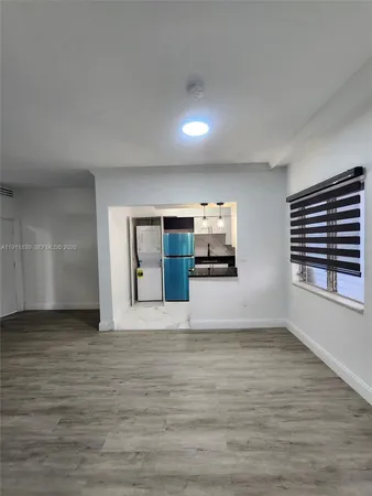 a kitchen with stainless steel appliances a stove and a refrigerator