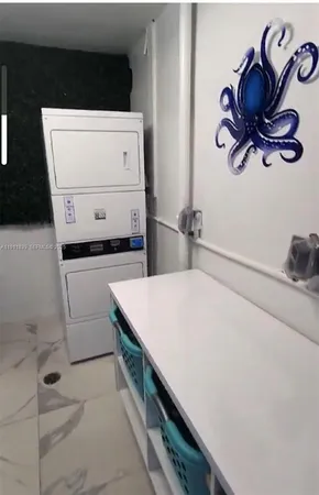 a kitchen with a cabinets and white appliances