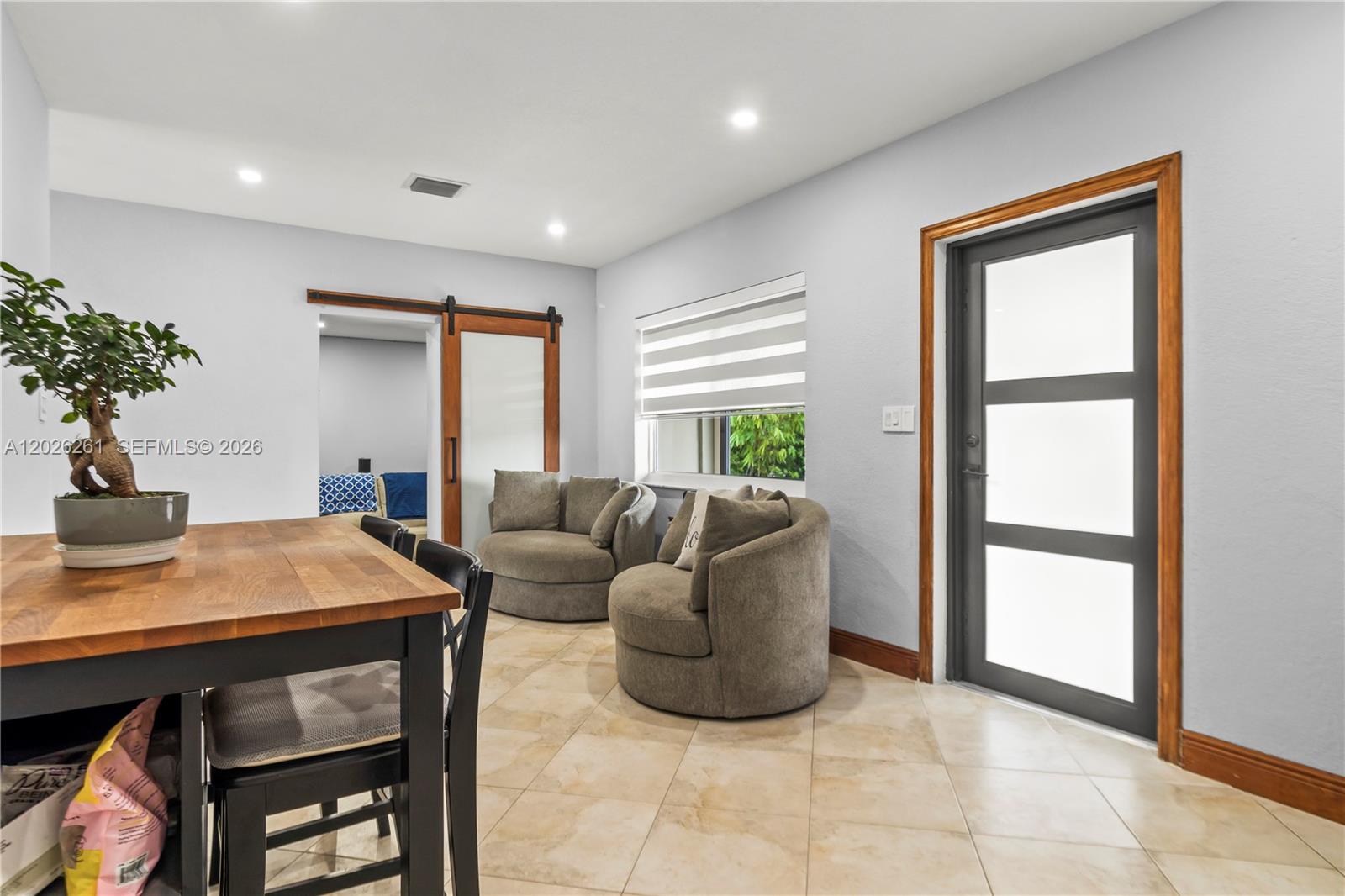 6250 Southwest 20th Terrace Miami, FL 33155 - Photo 11 of 42 a living room with furniture and a potted plant